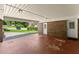 Spacious covered carport featuring brick wall and an entrance door at 2826 Summit Ridge Dr, Marietta, GA 30066