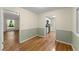 Dining room with decorative walls and hardwood floors that connects to the kitchen at 2826 Summit Ridge Dr, Marietta, GA 30066