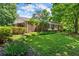 Charming brick home with a well-manicured lawn and mature trees in a picturesque setting at 2826 Summit Ridge Dr, Marietta, GA 30066