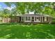 Charming brick home featuring a well-manicured lawn and a welcoming front porch at 2826 Summit Ridge Dr, Marietta, GA 30066