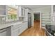 Updated kitchen featuring granite countertops, stainless steel appliances, and hardwood floors at 2826 Summit Ridge Dr, Marietta, GA 30066