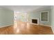 Spacious living room featuring hardwood floors, a decorative fireplace, and plenty of natural light at 2826 Summit Ridge Dr, Marietta, GA 30066