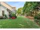 Large, grassy backyard with a playset, ideal for Gathering fun and outdoor activities at 2740 Greymont Ct, Cumming, GA 30041