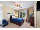 Bedroom with a large window, ceiling fan, and blue accents, perfect for a  at 2740 Greymont Ct, Cumming, GA 30041
