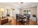 Bright dining room with hardwood floors and a view of the entryway, ideal for Gathering meals and gatherings at 2740 Greymont Ct, Cumming, GA 30041