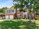 Lovely two-story home boasts a brick facade, lush lawn, and a convenient two-car garage, ideal for suburban living at 2740 Greymont Ct, Cumming, GA 30041