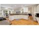 Bright kitchen features granite countertops, white cabinets, and hardwood flooring at 2740 Greymont Ct, Cumming, GA 30041