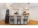 Open kitchen with barstool seating, granite countertops and stainless steel appliances at 2740 Greymont Ct, Cumming, GA 30041