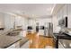 Large kitchen with granite countertops, stainless steel appliances, and white cabinetry at 2740 Greymont Ct, Cumming, GA 30041