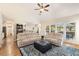 Open living room with vaulted ceilings, large windows, and hardwood floors at 2740 Greymont Ct, Cumming, GA 30041