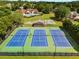 Enjoy a game of tennis on these well-maintained blue and green courts at 2740 Greymont Ct, Cumming, GA 30041