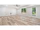 Well-lit basement featuring luxury vinyl flooring, a walk out to the backyard, and plenty of room to design your dream space at 275 Springs Xing, Canton, GA 30114
