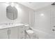 This bathroom has a white shower-tub combo and a vanity with a big mirror at 275 Springs Xing, Canton, GA 30114