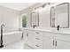 Elegant bathroom with double vanity, marble countertop, soaking tub, and modern fixtures at 275 Springs Xing, Canton, GA 30114