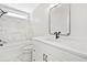 Modern bathroom with marble accent wall, sleek fixtures, and a bright vanity, combining style and functionality at 275 Springs Xing, Canton, GA 30114