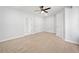 This carpeted bedroom has neutral walls and a ceiling fan at 275 Springs Xing, Canton, GA 30114