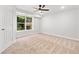Cozy bedroom featuring neutral carpet, a ceiling fan, and ample natural light, creating a serene and inviting space at 275 Springs Xing, Canton, GA 30114