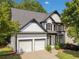 Lovely two-story home with a two-car garage, traditional design, and a well-maintained front yard at 275 Springs Xing, Canton, GA 30114