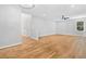 Spacious living room with hardwood floors, a ceiling fan, and ample natural light at 275 Springs Xing, Canton, GA 30114