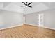 Spacious main bedroom with a tray ceiling, ceiling fan, and hardwood floors at 275 Springs Xing, Canton, GA 30114
