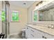 Modern bathroom with double vanity, marble countertops, and glass-enclosed shower at 115 Edgewater Way, Peachtree City, GA 30269