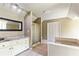 Bathroom featuring built-in soaking tub, shower, and an abundance of storage at 115 Edgewater Way, Peachtree City, GA 30269