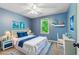 Blue bedroom featuring crisp white furniture and maritime-themed decor accents at 115 Edgewater Way, Peachtree City, GA 30269