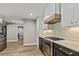 Well-equipped kitchen featuring stainless steel appliances and custom cabinets at 115 Edgewater Way, Peachtree City, GA 30269