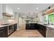 Modern kitchen featuring stainless steel appliances, granite countertops, and ample cabinet space at 115 Edgewater Way, Peachtree City, GA 30269