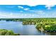 Beautiful aerial view of lake and tree filled land to offer privacy and adventure at 115 Edgewater Way, Peachtree City, GA 30269