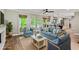 Cozy living room with stylish furniture and seamless flow to kitchen at 115 Edgewater Way, Peachtree City, GA 30269
