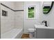 Stylish bathroom featuring marble-look tiles, a modern vanity, and a sleek black faucet at 1400 North Avenue Nw, Atlanta, GA 30318