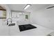 Modern kitchen with an island cooktop, sleek countertops, and a white color scheme at 1400 North Avenue Nw, Atlanta, GA 30318
