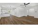 Open-concept living space featuring hardwood floors, white walls, modern lighting and a view of the kitchen at 1400 North Avenue Nw, Atlanta, GA 30318