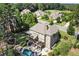 Aerial view of a brick home with lush backyard and pool area in a well-established neighborhood at 2380 Tayside Nw Xing, Kennesaw, GA 30152