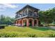 Community amenity center with outdoor seating, a balcony, and well-maintained lawn area for social gatherings at 2380 Tayside Nw Xing, Kennesaw, GA 30152