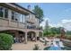 Elegant brick home with covered patio and pool offers a relaxing outdoor living space at 2380 Tayside Nw Xing, Kennesaw, GA 30152