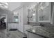 Elegant bathroom with double vanities, granite countertops, modern lighting, and stylish tile flooring at 2380 Tayside Nw Xing, Kennesaw, GA 30152