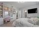 Bedroom with a hanging chair, tv, vanity and ensuite bathroom at 2380 Tayside Nw Xing, Kennesaw, GA 30152