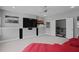 Comfortable bonus room offering a red sectional sofa, ceiling fan, and large tv screen at 2380 Tayside Nw Xing, Kennesaw, GA 30152