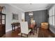 Charming dining room featuring stylish lighting, wood floors, and modern decor at 2380 Tayside Nw Xing, Kennesaw, GA 30152