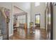 Elegant foyer features hardwood floors, high ceilings, staircase, and views into the living spaces at 2380 Tayside Nw Xing, Kennesaw, GA 30152