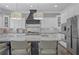 Well-equipped kitchen boasts white cabinets, a large island with seating, and a stainless steel refrigerator at 2380 Tayside Nw Xing, Kennesaw, GA 30152