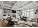 Bright living room with coffered ceilings, built-in shelving, fireplace, and large windows at 2380 Tayside Nw Xing, Kennesaw, GA 30152
