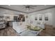 Bright living room with hardwood floors, ceiling fan, recessed lights, and view to kitchen at 2380 Tayside Nw Xing, Kennesaw, GA 30152