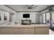 Large living room boasts modern furnishings, ceiling fan, and access to outdoor space at 2380 Tayside Nw Xing, Kennesaw, GA 30152