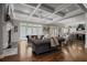 Spacious living room with coffered ceiling, hardwood floors, and access to outdoor patio at 2380 Tayside Nw Xing, Kennesaw, GA 30152