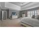 Bright main bedroom with plush carpets, neutral walls, shutters, and a modern ceiling fan at 2380 Tayside Nw Xing, Kennesaw, GA 30152