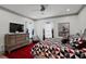 Inviting main bedroom with ceiling fan, dresser, and neutral decor at 2380 Tayside Nw Xing, Kennesaw, GA 30152