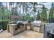 Outdoor kitchen featuring a built-in grill, countertop space and storage for outdoor cooking at 2380 Tayside Nw Xing, Kennesaw, GA 30152